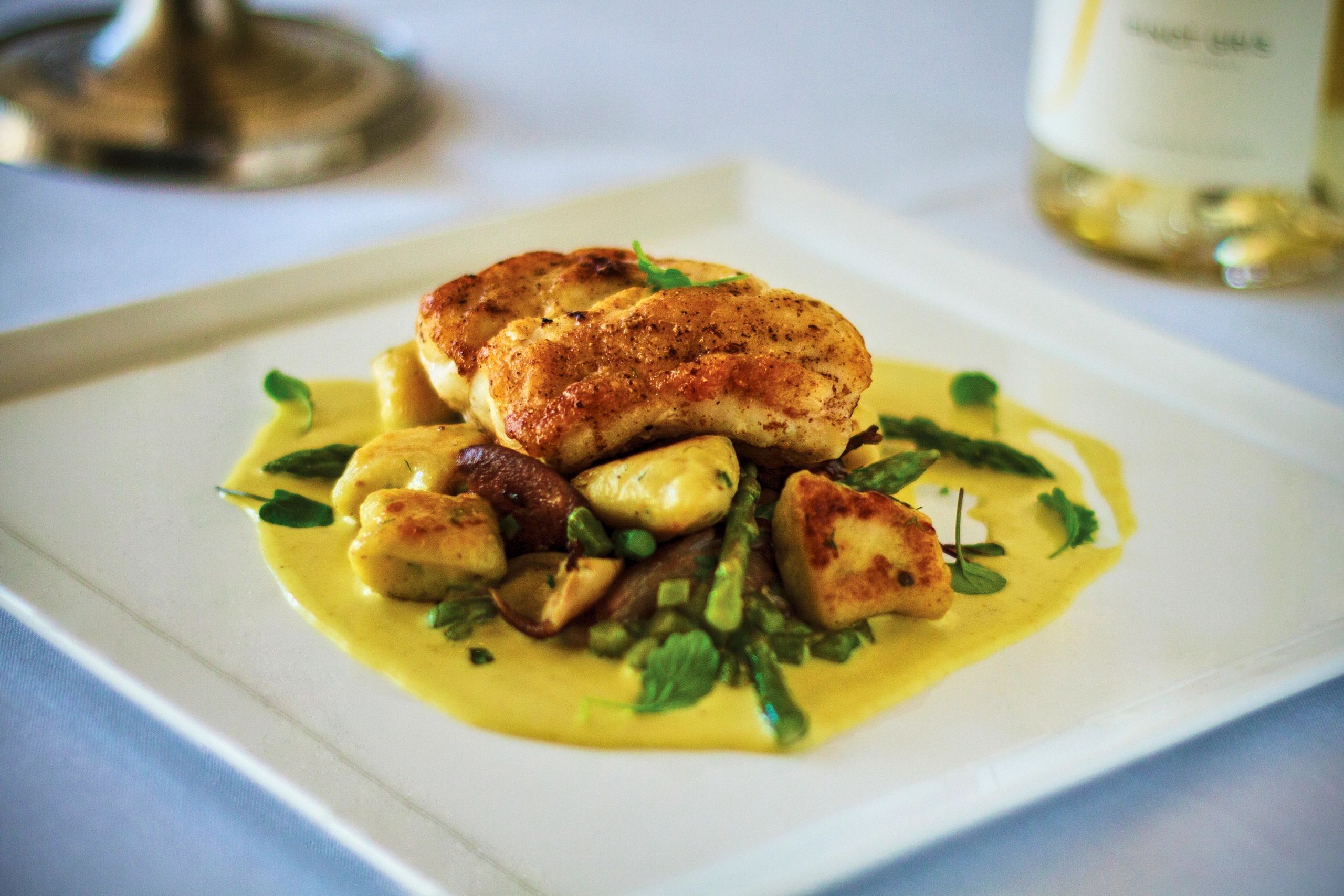 Halibut plated with vegetables